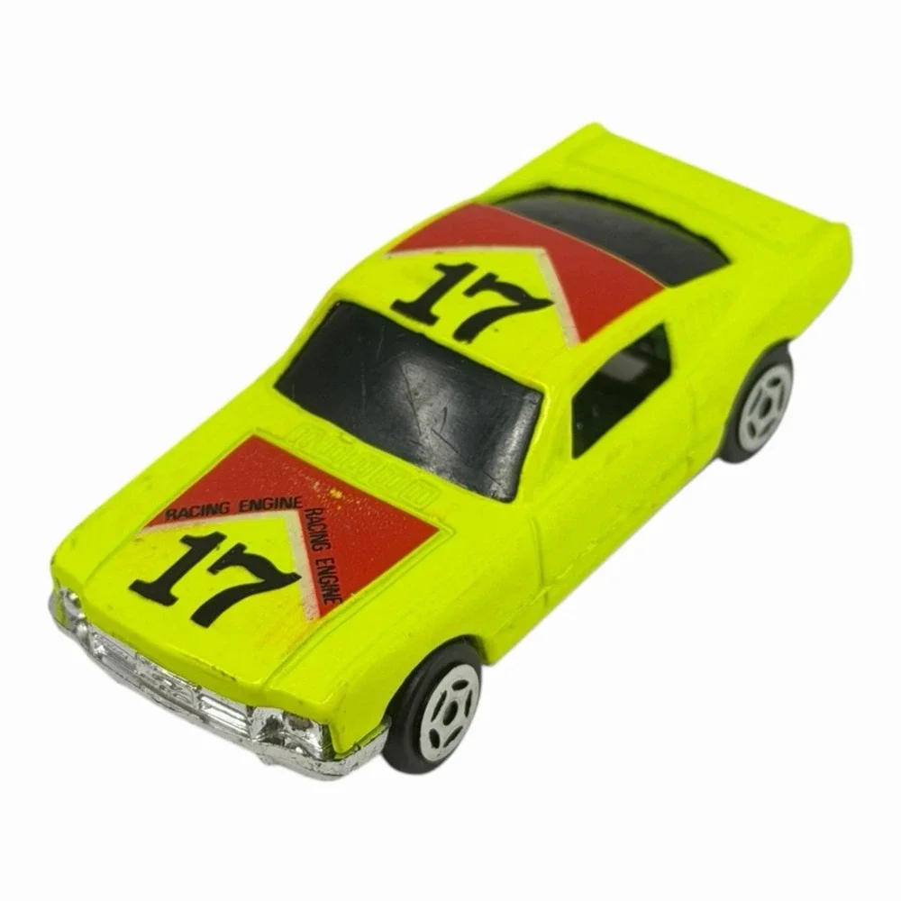 Vintage Yellow Diecast Toy Car with Racing Decals‎